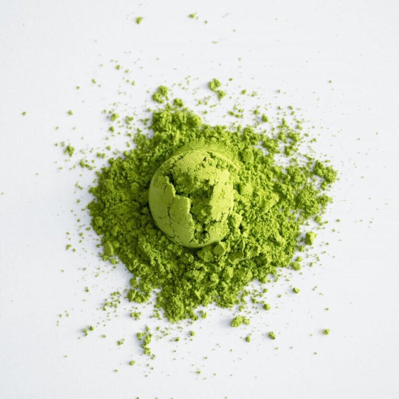 A precious pile of Matcha Houju by Rishi Tea & Botanicals on a white background.