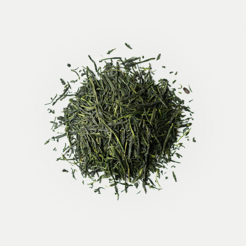 Green tea leaves on a white background