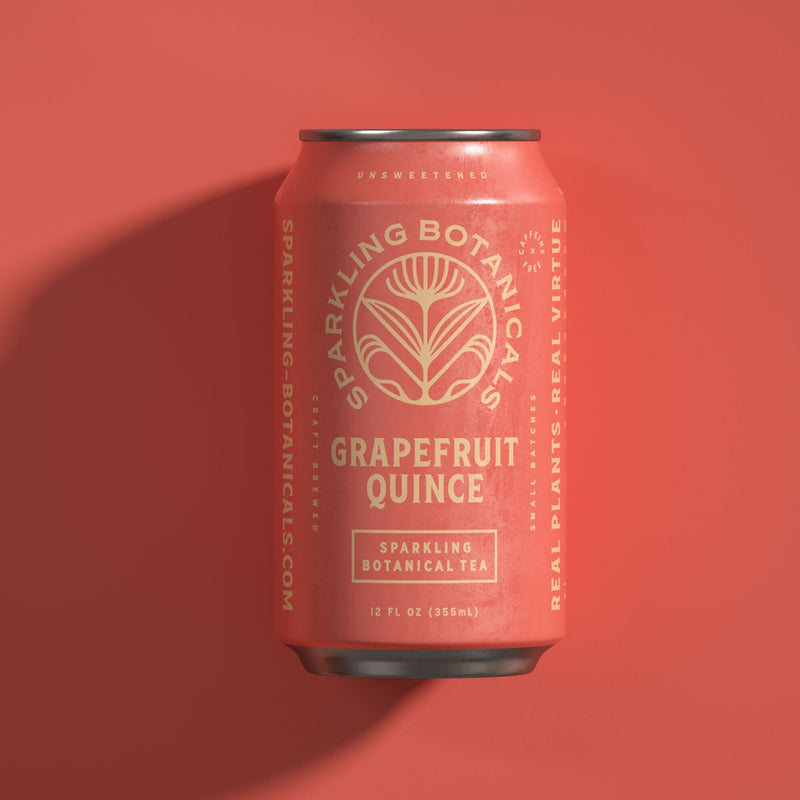 A can of Rishi Tea & Botanicals' Sparkling Botanicals Yuzu Grapefruit Quince Sparkling Botanical Tea sits elegantly on an orange background.