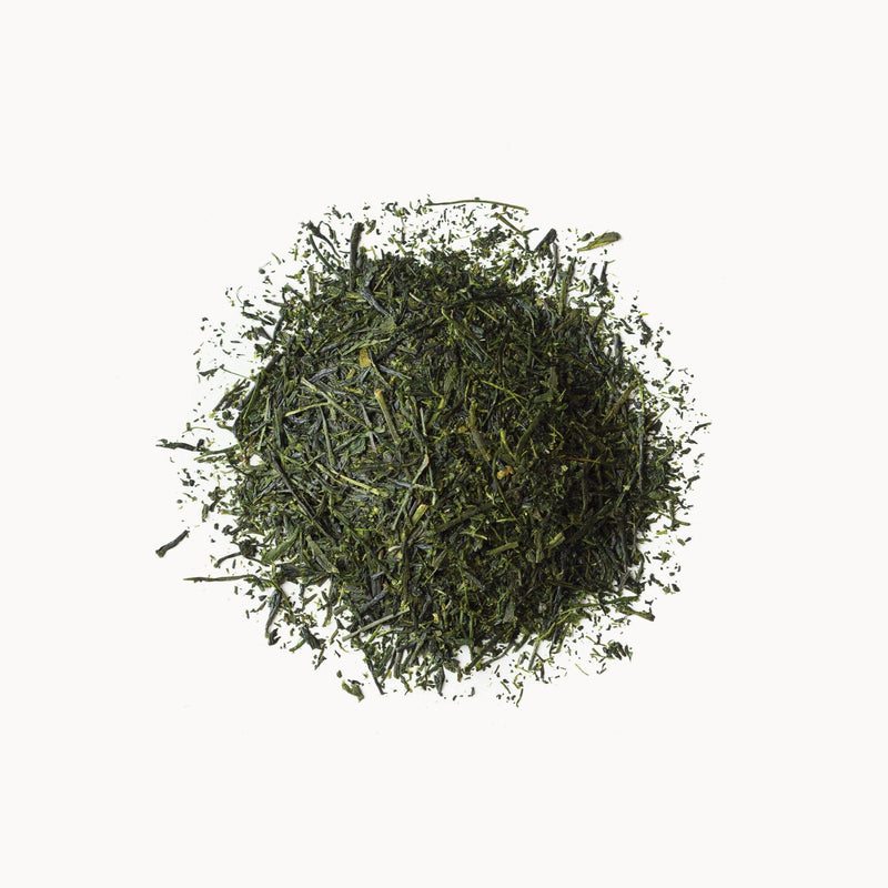 A pile of Sencha tea from Rishi Tea & Botanicals on a white background.