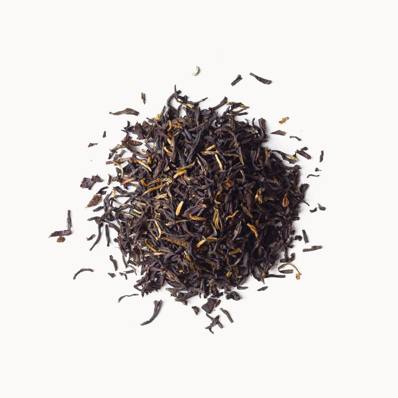 A pile of Rishi Tea & Botanicals Vanilla Bean on a white background.