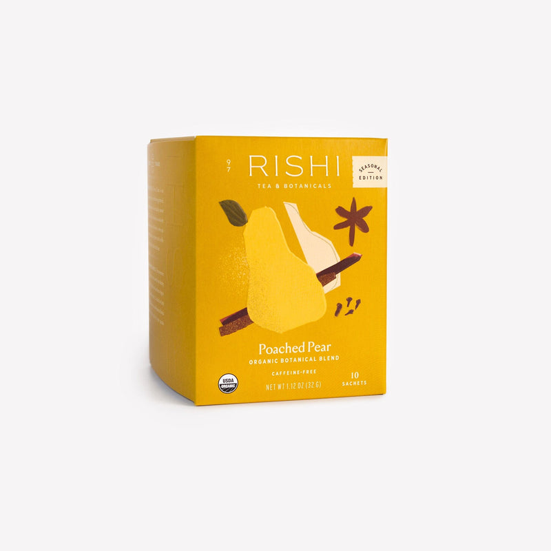 A yellow box of Rishi Tea & Botanicals Poached Pear organic blend, decorated with pears and spices, contains 10 sachets infused with pear essence and holiday spices.