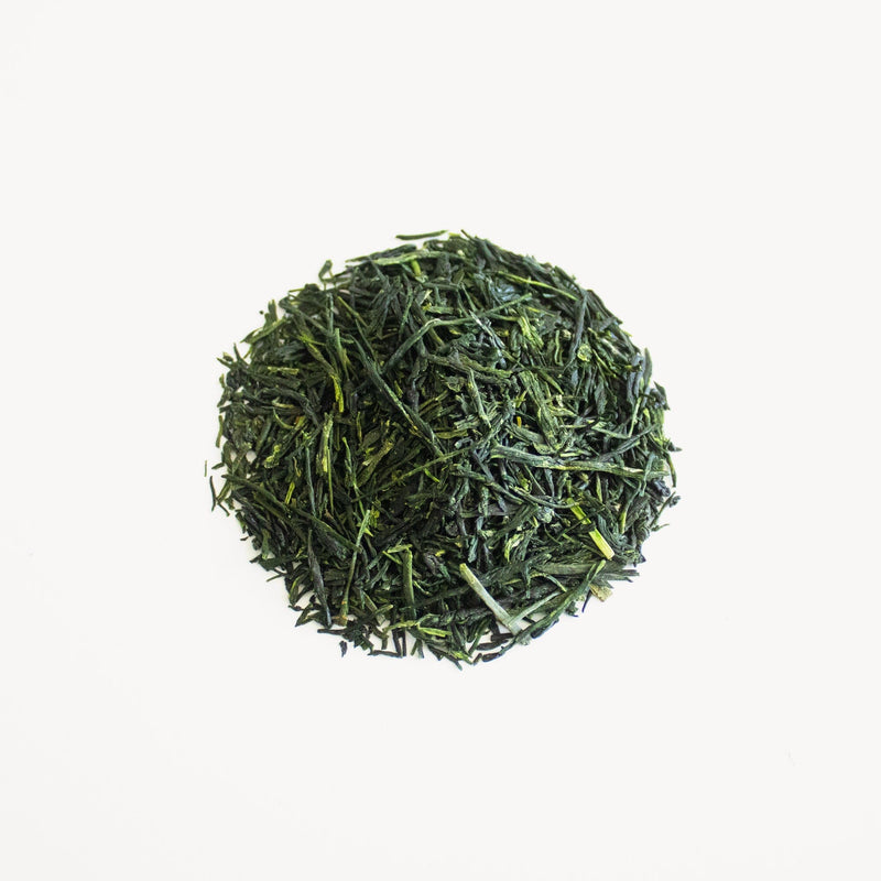 A pile of Uji Hien Gyokuro (Secret Garden) from Rishi Tea & Botanicals on a white background.